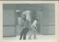 Ronald Kimber and Jay Hagans rollerskating